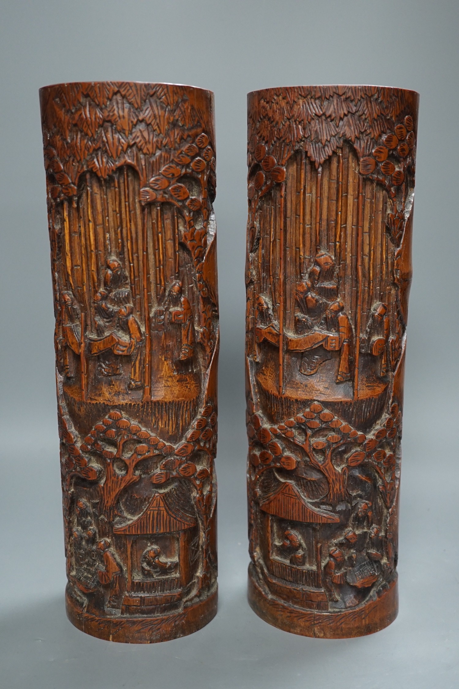 A pair of Chinese carved bamboo brush pots, 35 cms high